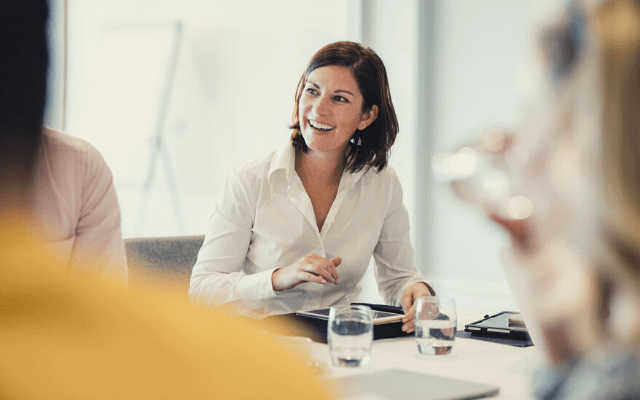 woman in white shirt in the meeting