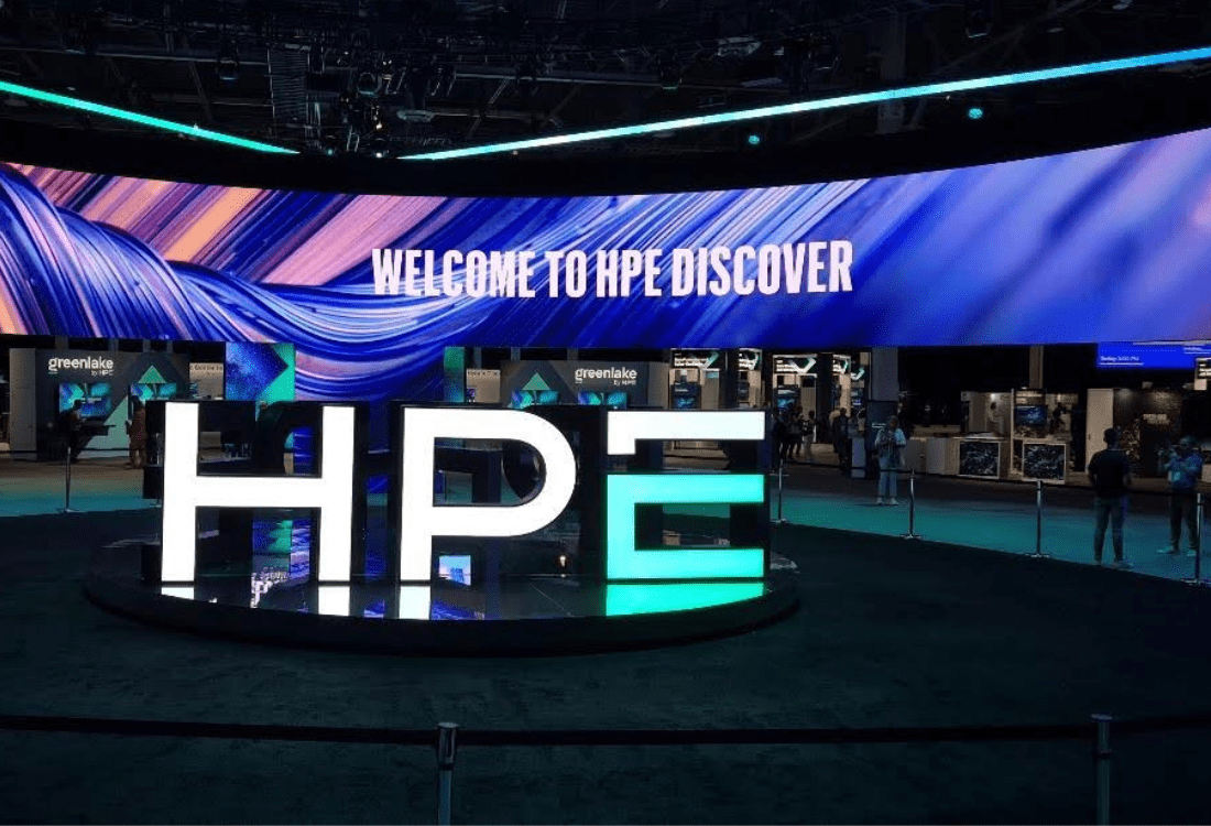HPE Discover 2025 event entrance showcasing the HPE logo and GreenLake displays, highlighting themes of AI, cyber resilience, and hybrid cloud infrastructure.